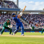 Cricket Batting Action in a Packed Stadium