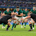 International rugby teams competing in a Rugby World Cup match in a packed stadium.