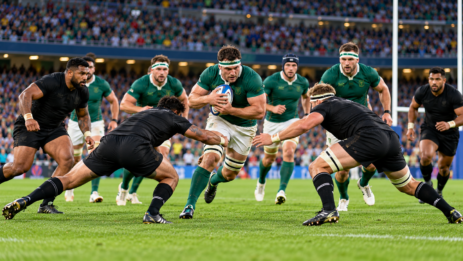 International rugby teams competing in a Rugby World Cup match in a packed stadium.